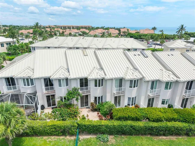 a view of a livingroom with a ceiling fan and window