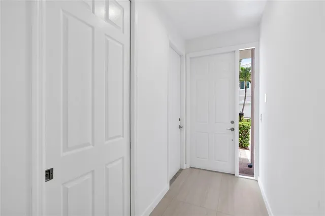 a kitchen with a sink and chandelier