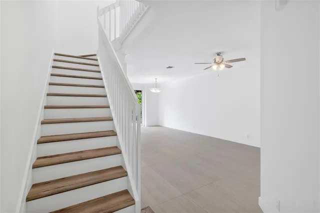 a kitchen with a sink stove and refrigerator