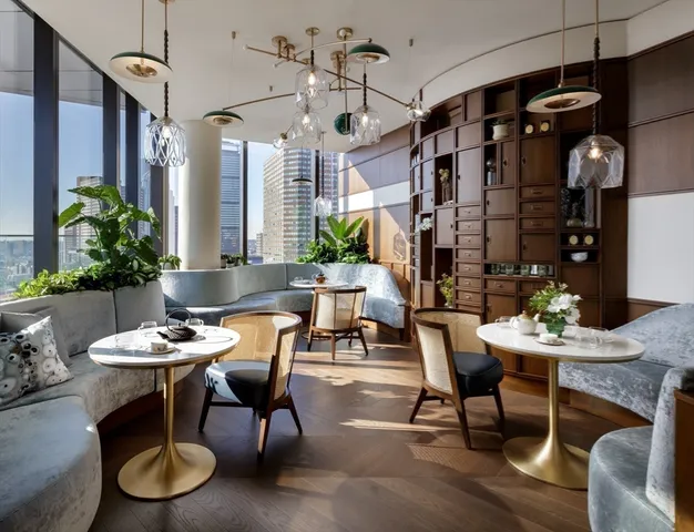 a dining room with furniture and window