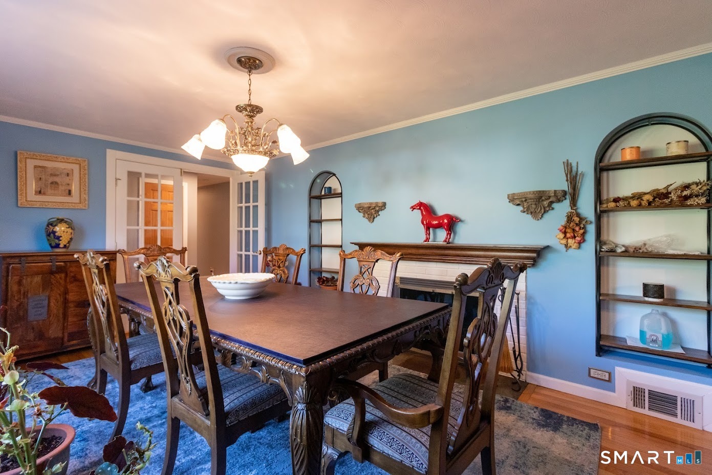 763 North Street Suffield, CT 06078 - Photo 15 of 40 a view of a dining room with furniture and a chandelier