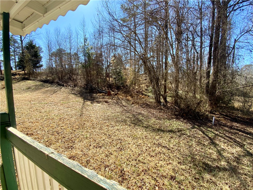 631 Masaw Lane Seneca, SC 29672 - Photo 12 of 32 This expansive yard offers ample space, bordered by mature trees.
