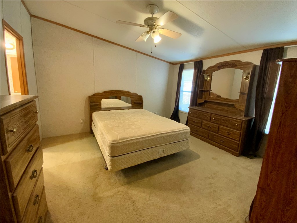 631 Masaw Lane Seneca, SC 29672 - Photo 14 of 32 This spacious bedroom offers ample natural light and a comfortable atmosphere for relaxation.