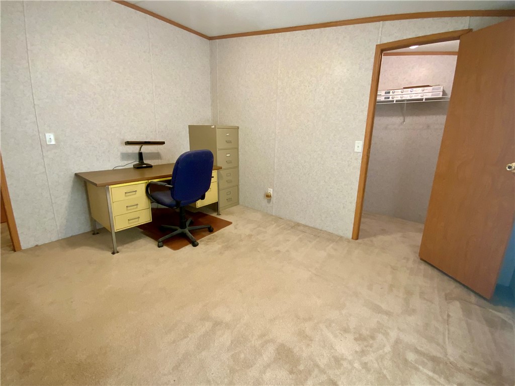 631 Masaw Lane Seneca, SC 29672 - Photo 22 of 32 This spacious room offers comfortable carpet flooring, perfect for a cozy study or a peaceful bedroom retreat.
