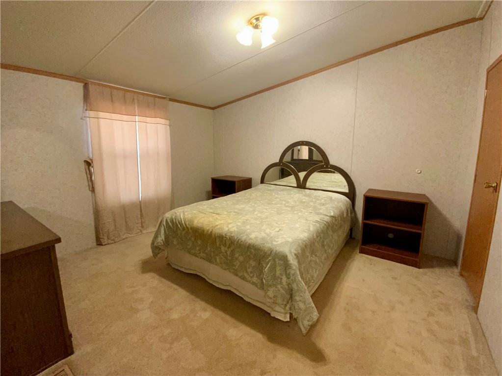 631 Masaw Lane Seneca, SC 29672 - Photo 24 of 32 This spacious bedroom offers ample space for personal comfort and relaxation.