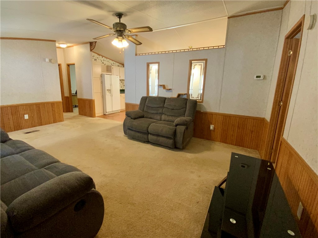 631 Masaw Lane Seneca, SC 29672 - Photo 7 of 32 This inviting living space features an open layout and soft carpet, ideal for comfortable daily living.