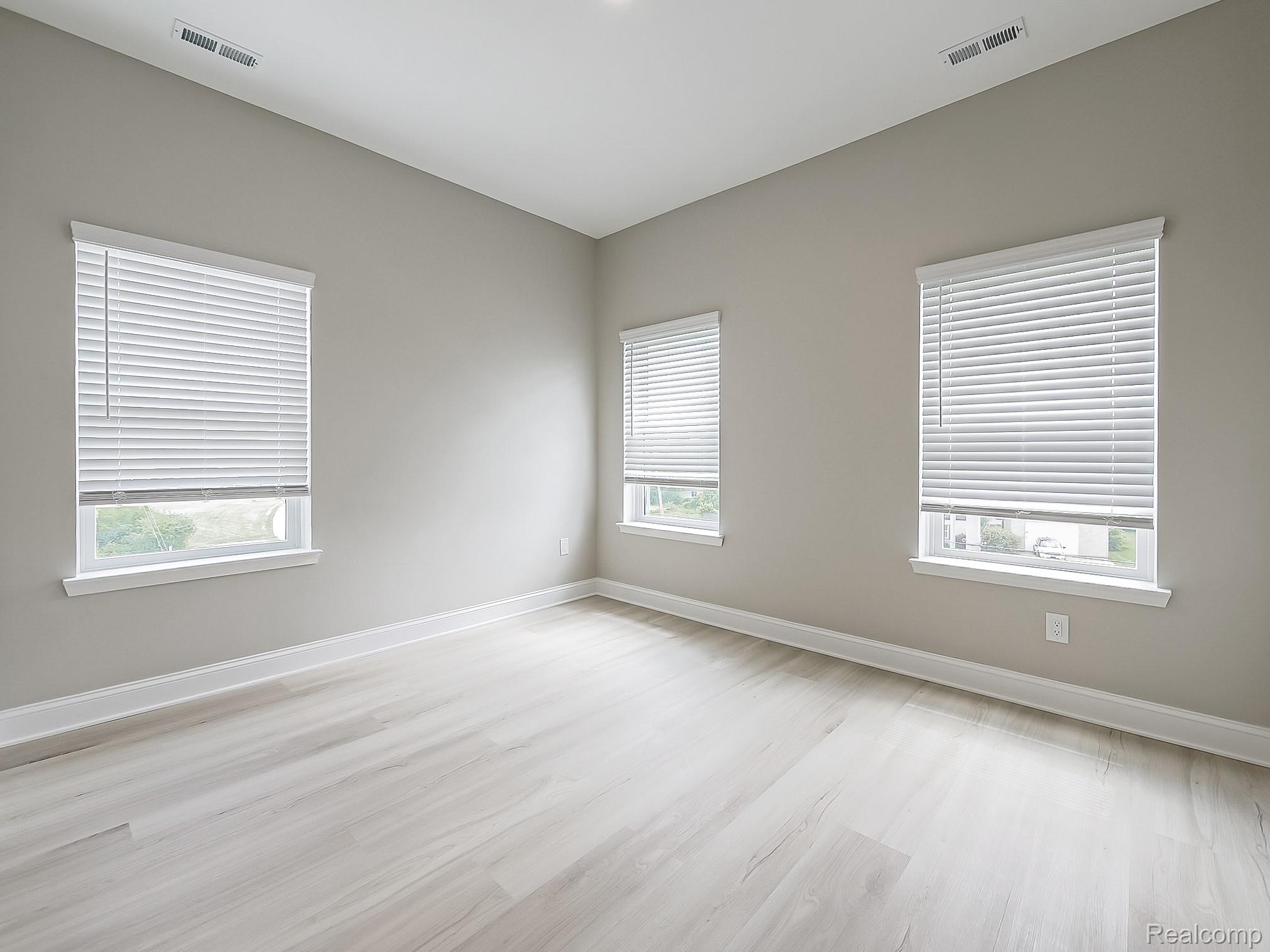 31480 Warren Road, Unit 101 Westland, MI 48185 - Photo 11 of 26 Spare room with baseboards and light wood-type flooring
