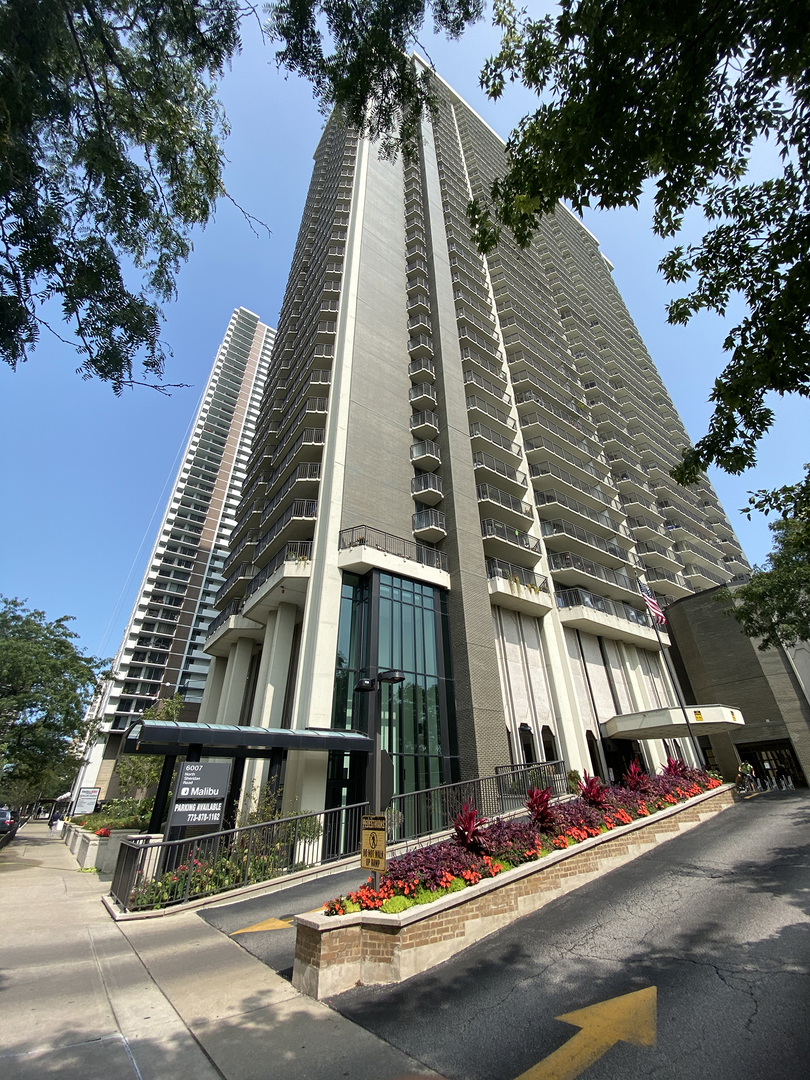 6007 North Sheridan Road, Unit 23D Chicago, IL 60660 - Photo 1 of 22 a view of swimming pool with building in the background