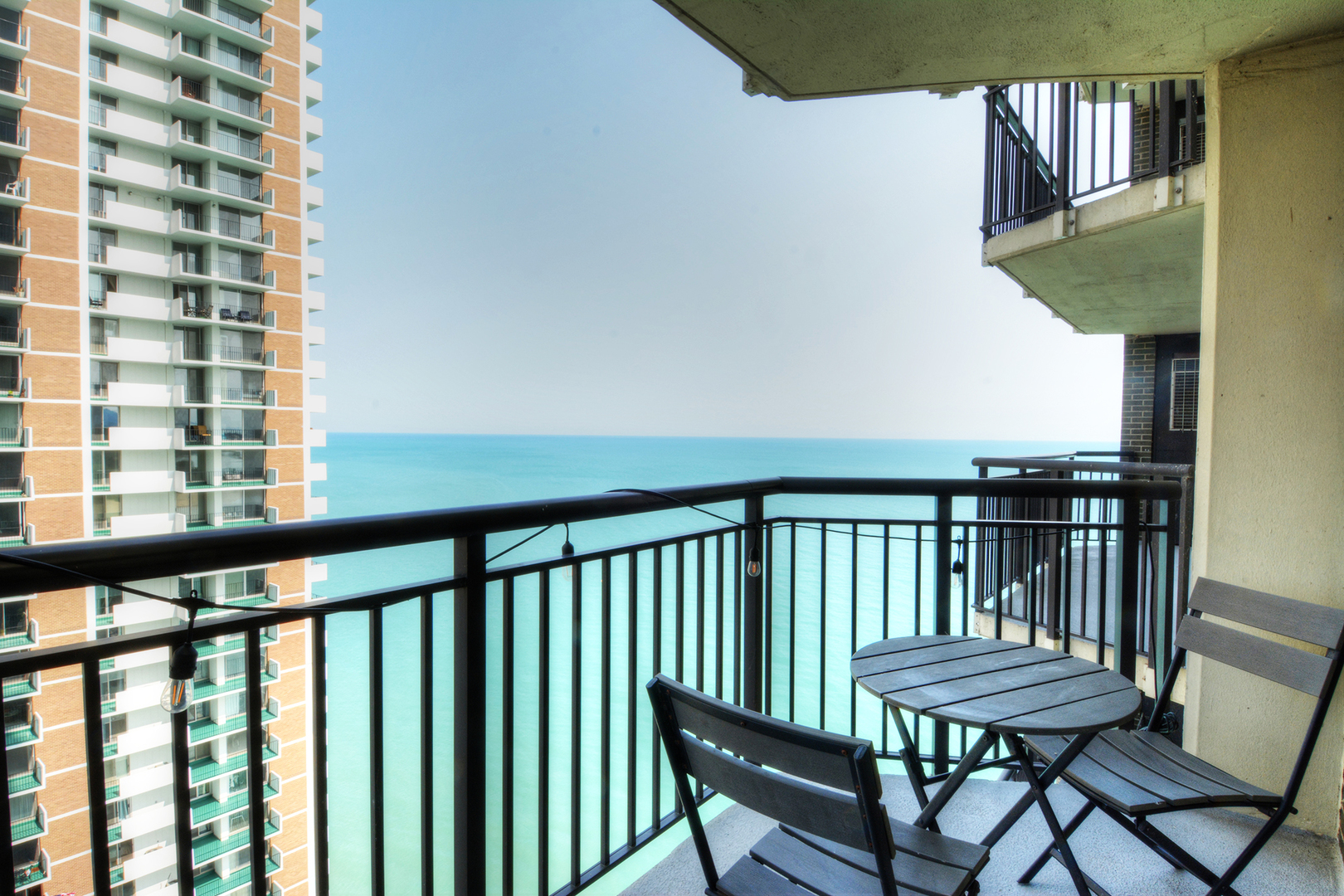 6007 North Sheridan Road, Unit 23D Chicago, IL 60660 - Photo 2 of 22 a view of a balcony with chairs