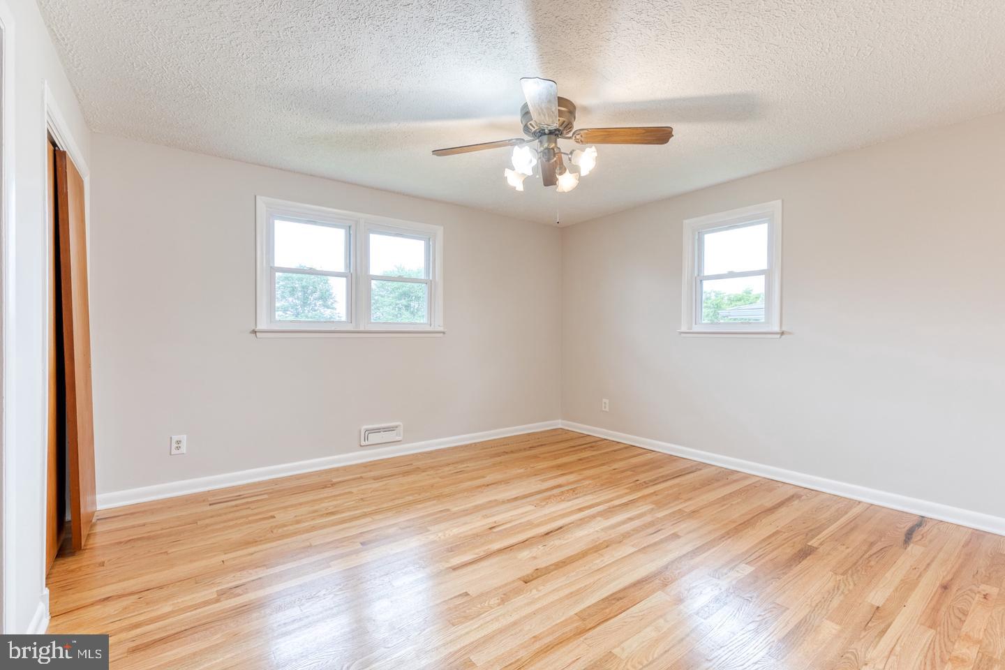 8306 Berkfield Road Baltimore, MD 21237 - Photo 8 of 29 Bright and airy room with hardwood floors.