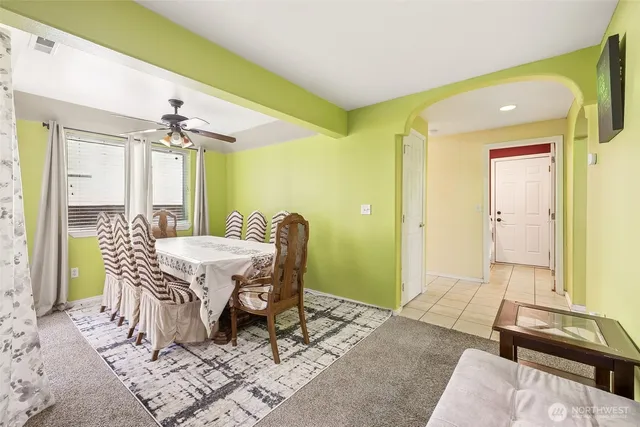 a dining room with furniture and window