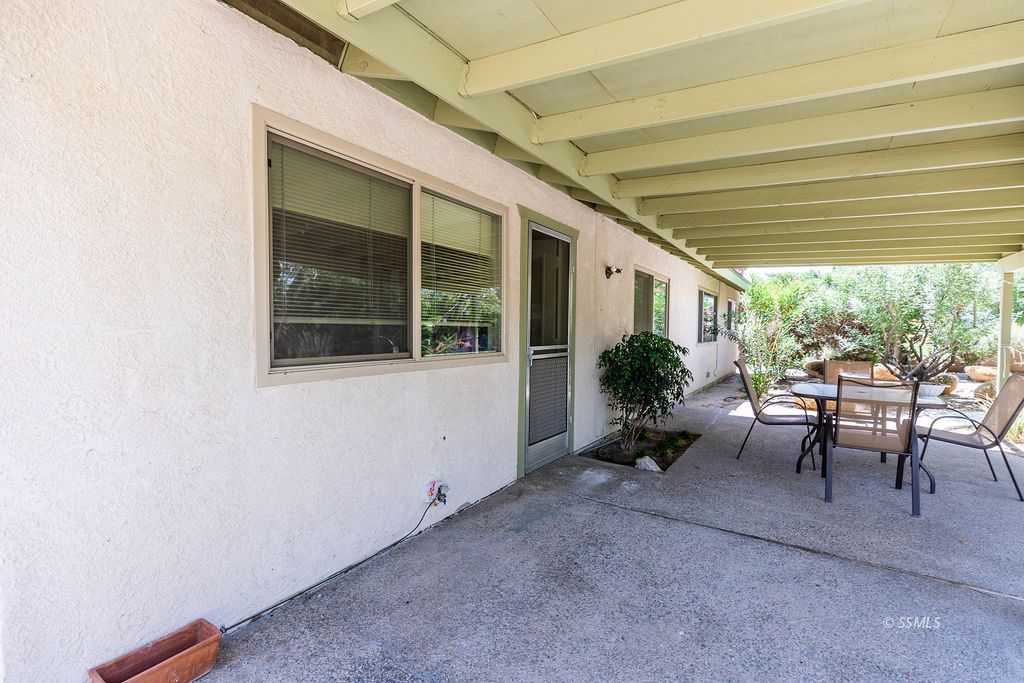 831 Peg Street Ridgecrest, CA 93555 - Photo 24 of 32 a view of a room with furniture and a window