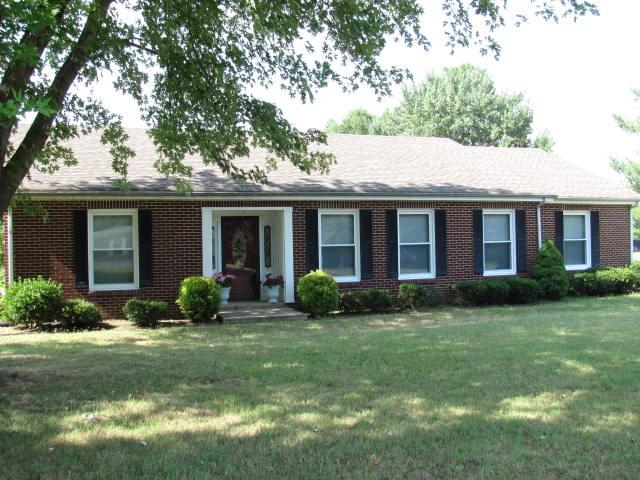 105 Adams Loop Tennessee Ridge, TN 37178 - Photo 1 of 20 a front view of house with yard and green space