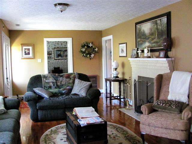 105 Adams Loop Tennessee Ridge, TN 37178 - Photo 11 of 20 a living room with furniture and a fireplace