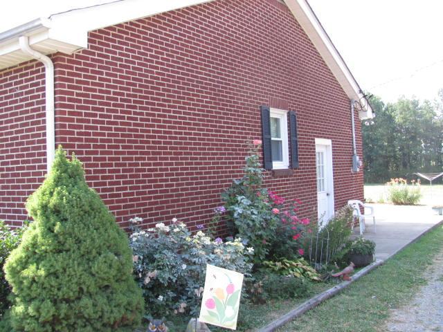 105 Adams Loop Tennessee Ridge, TN 37178 - Photo 15 of 20 a front view of a house with a yard