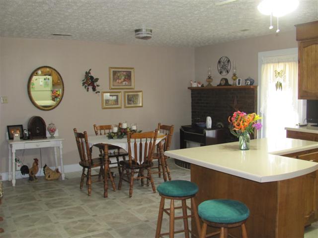 105 Adams Loop Tennessee Ridge, TN 37178 - Photo 8 of 20 a view of a dining room with furniture and chandelier