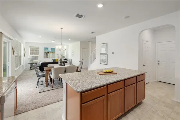 a view of a kitchen counter top space and living room