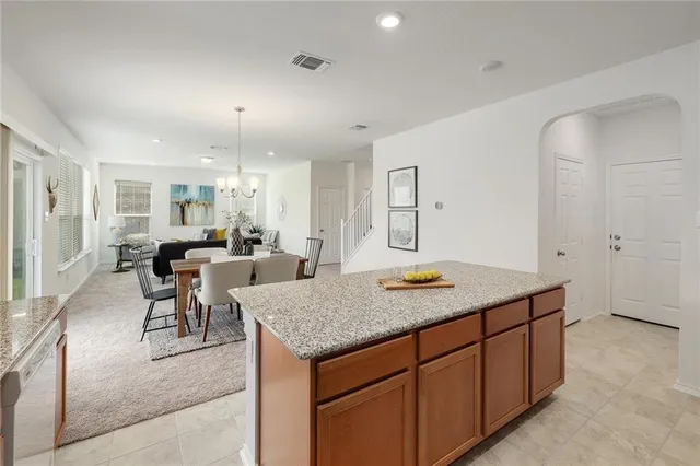 a view of a kitchen counter top space and living room