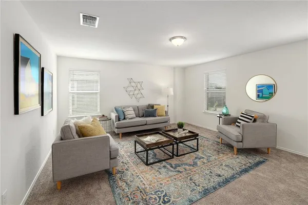 a living room with furniture and a couch