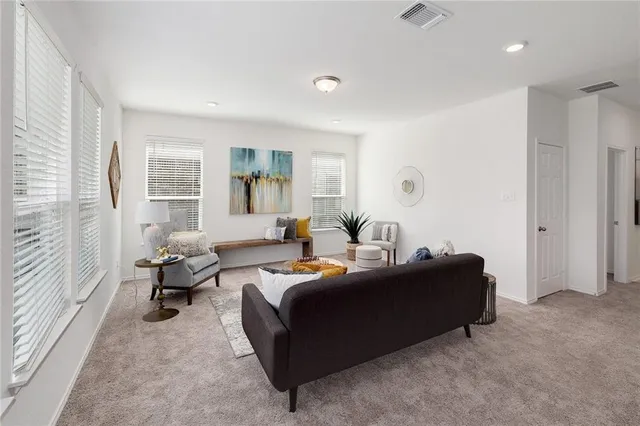 a living room with furniture and a window