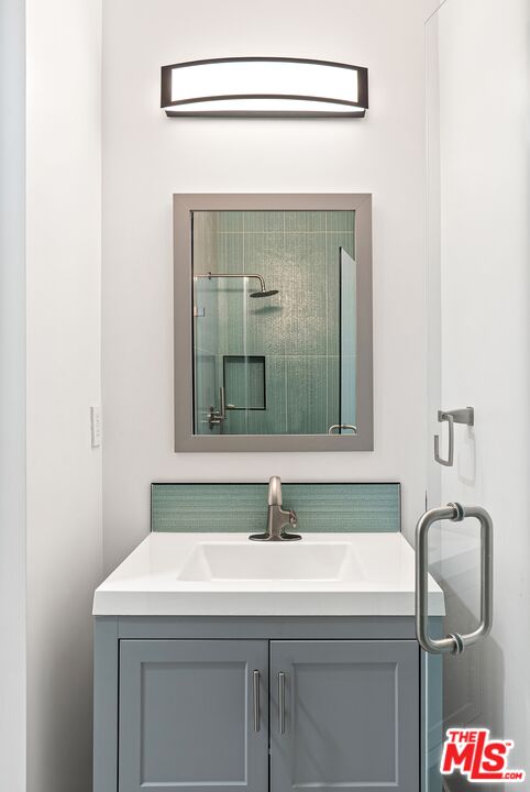 4118 Oak Hollow Road Calabasas, CA 91302 - Photo 12 of 55 a bathroom with a sink and a mirror