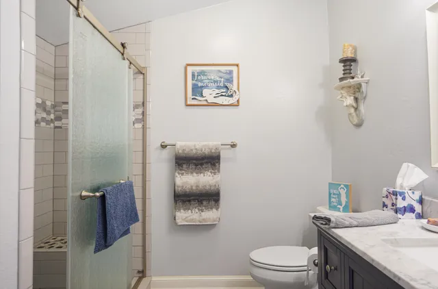 a bedroom with a bed and a fireplace