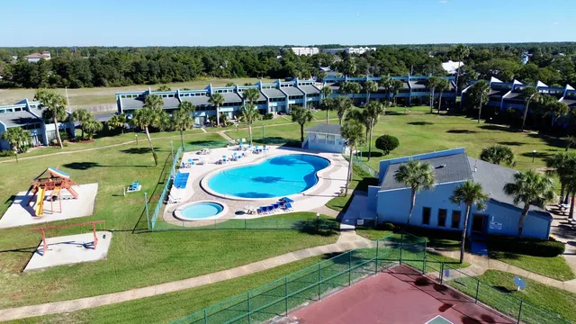 a view of a livingroom with wooden floor and a window