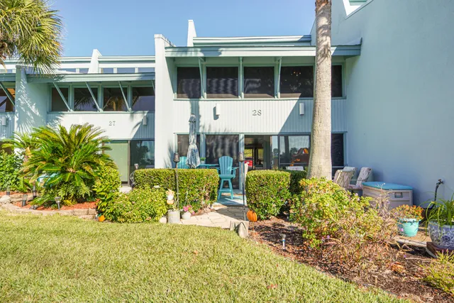 a view of a swimming pool with outdoor seating