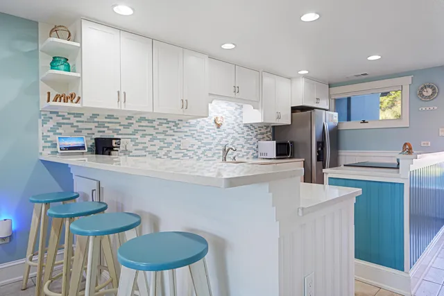 a kitchen with counter top space cabinets and stainless steel appliances