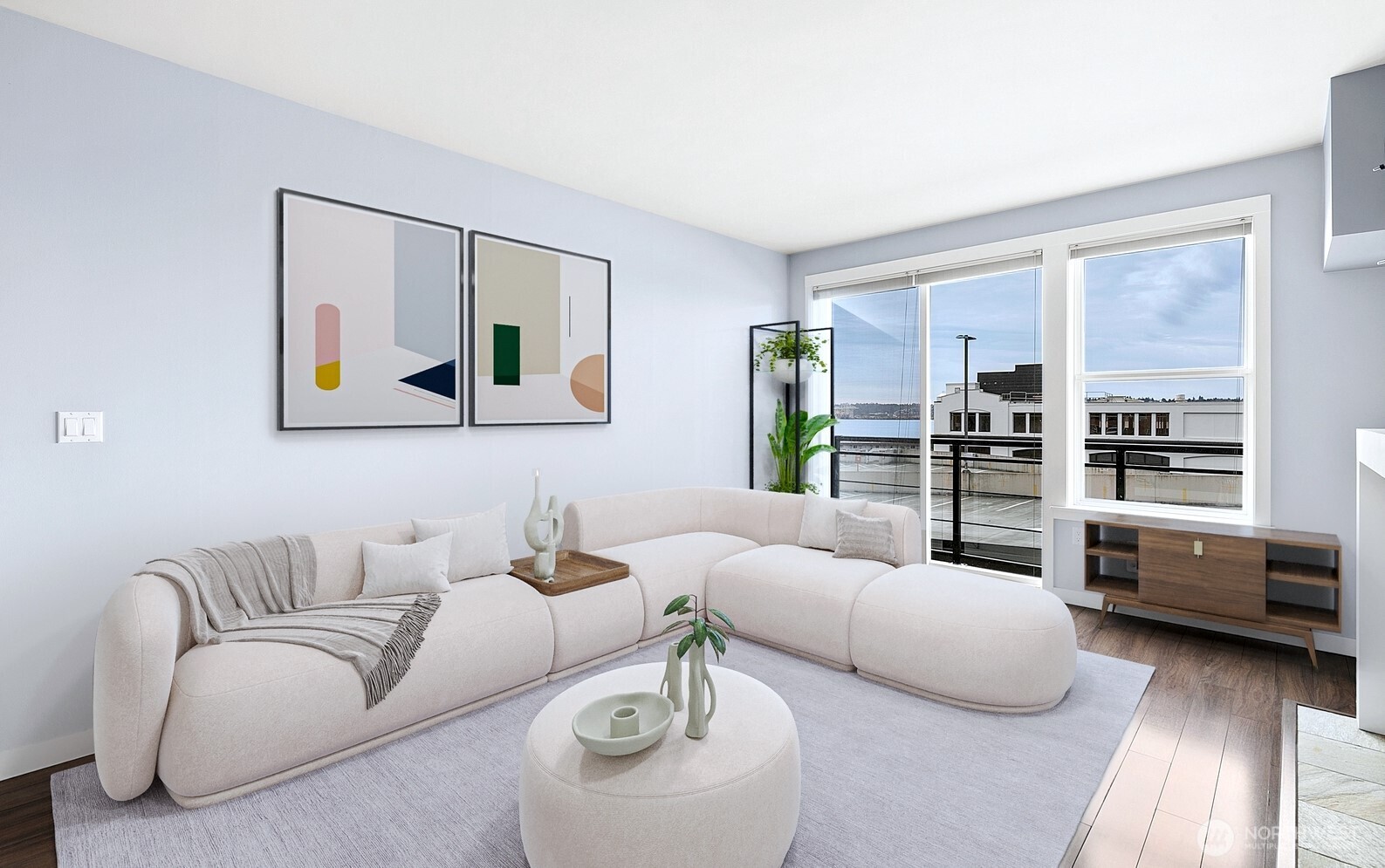 a living room with furniture and view of kitchen