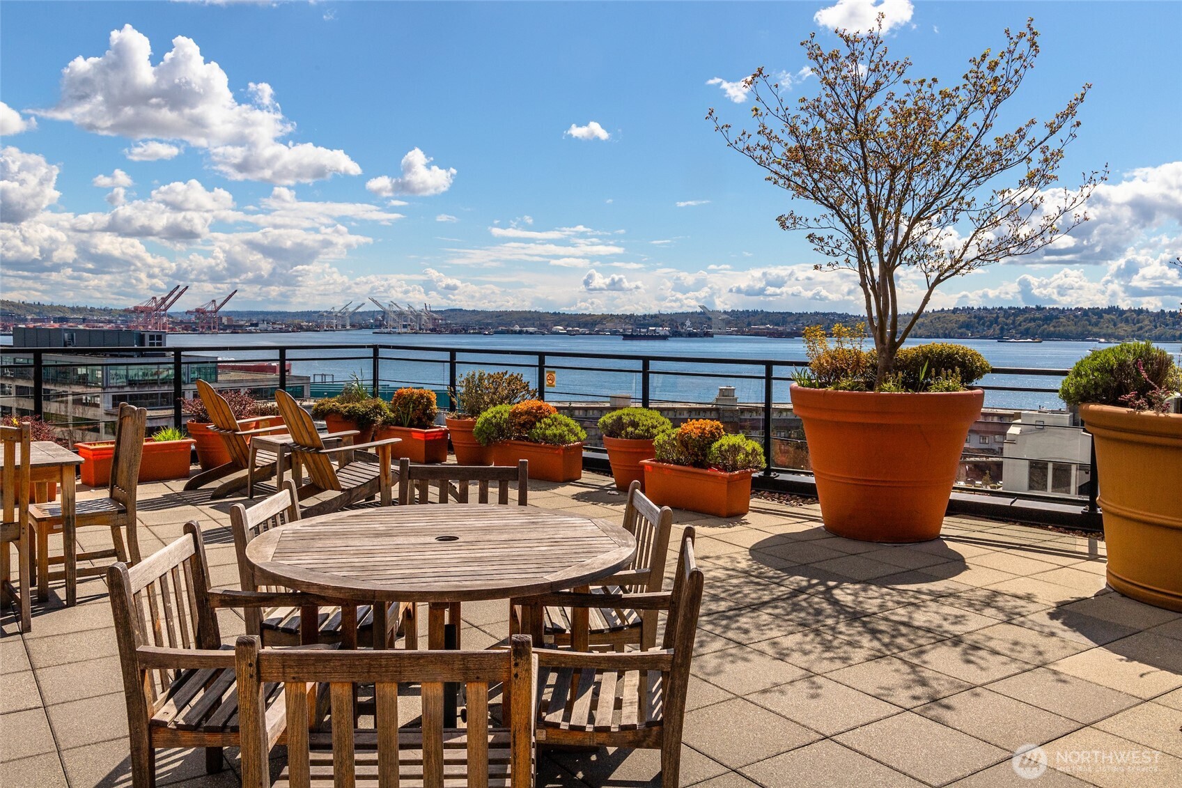 2607 Western Avenue, Unit 452 Seattle, WA 98121 - Photo 14 of 26 a view of a patio with table and chairs and potted plants