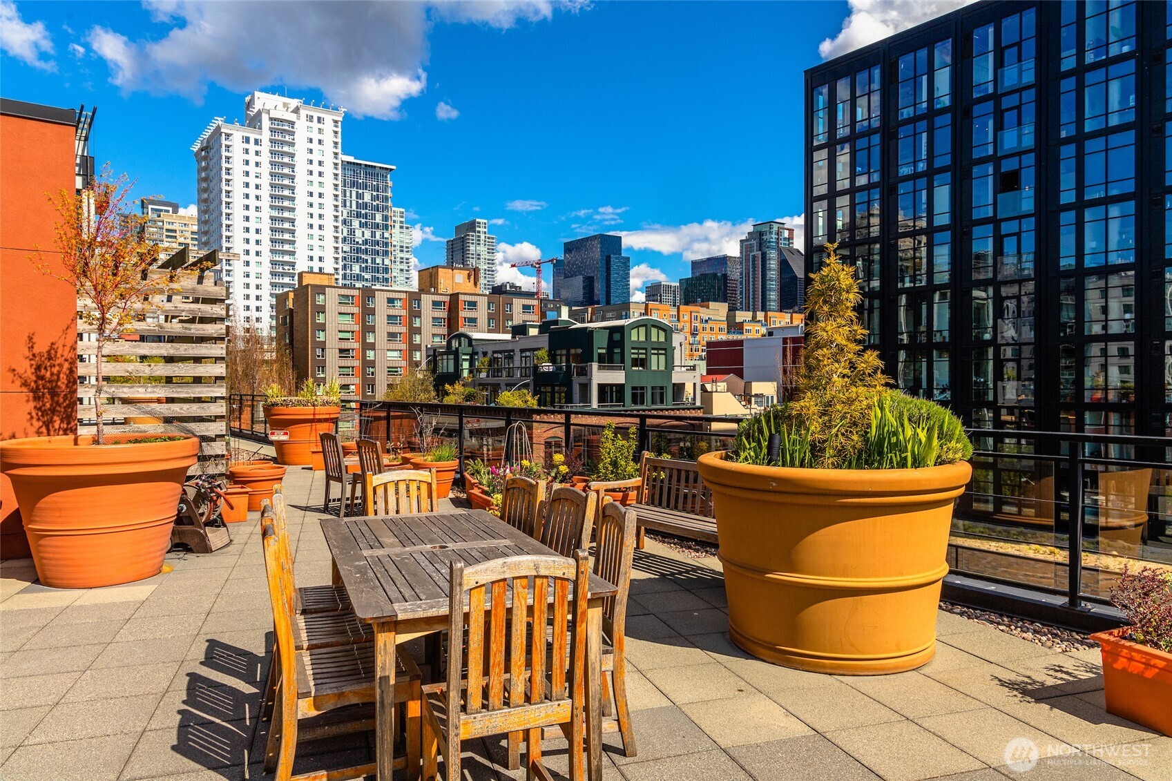 2607 Western Avenue, Unit 452 Seattle, WA 98121 - Photo 16 of 26 a view of a balcony with table and chairs
