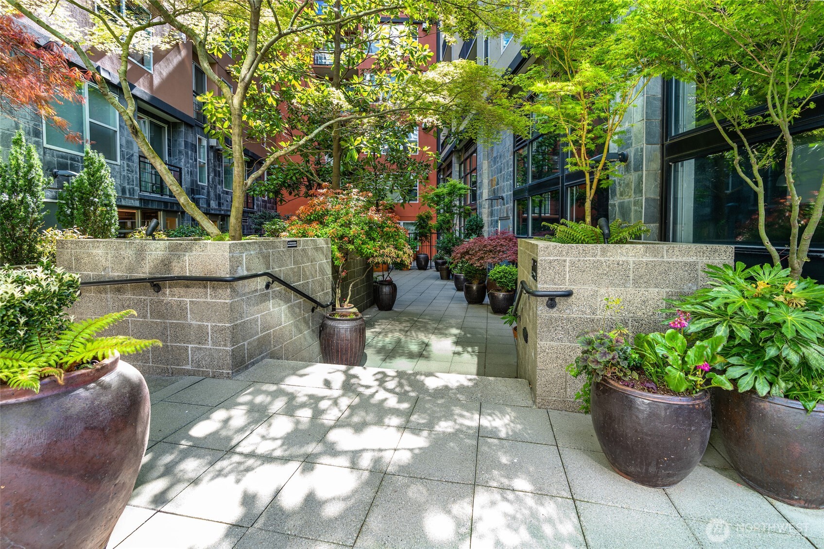 2607 Western Avenue, Unit 452 Seattle, WA 98121 - Photo 25 of 26 a view of a backyard with potted plants
