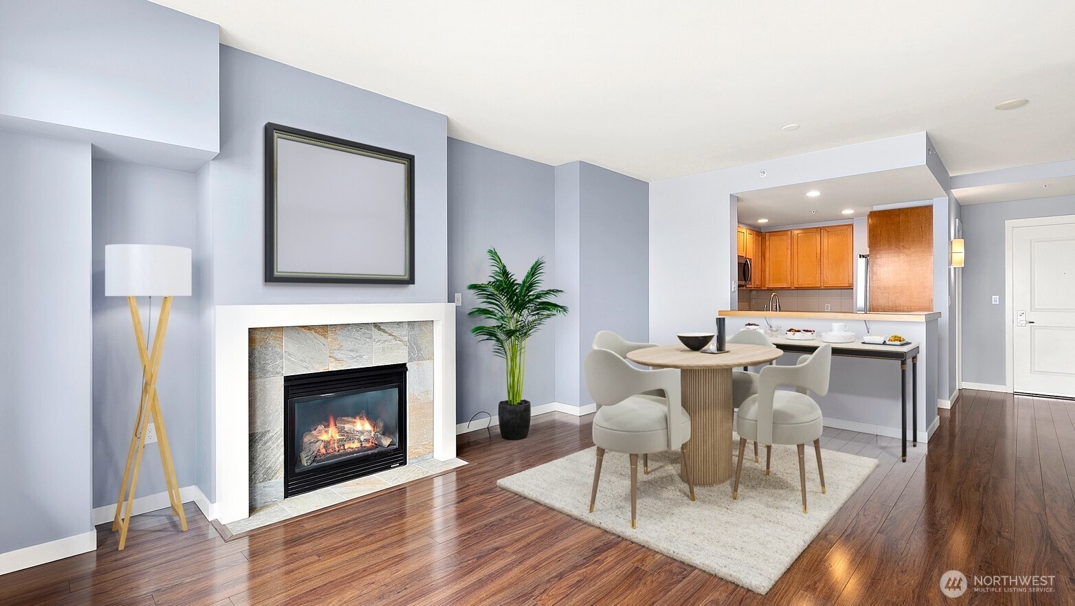 2607 Western Avenue, Unit 452 Seattle, WA 98121 - Photo 4 of 25 a living room with furniture a fireplace and a table