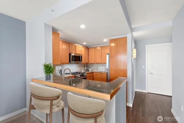a kitchen with a sink cabinets and window