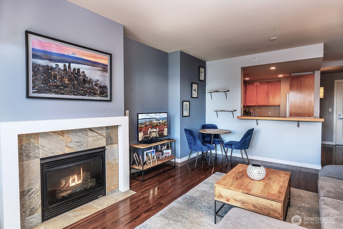 2607 Western Avenue, Unit 452 Seattle, WA 98121 - Photo 5 of 26 a living room with furniture and a fireplace