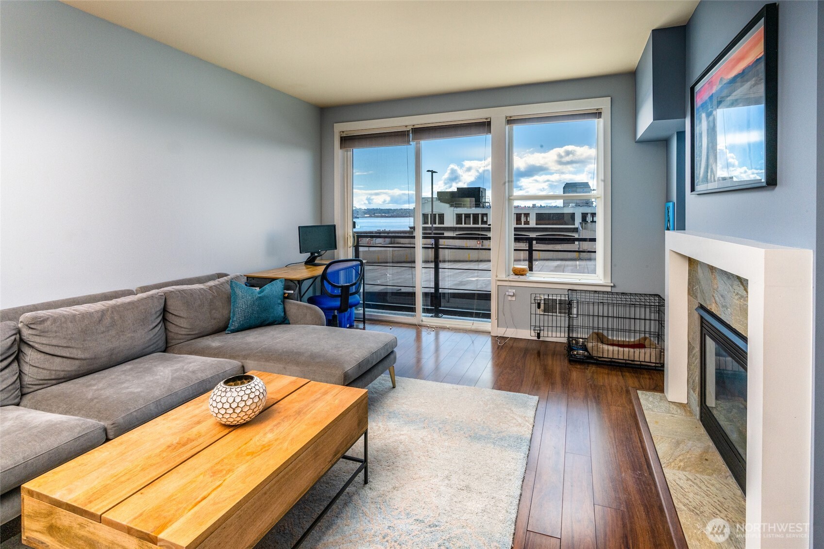 2607 Western Avenue, Unit 452 Seattle, WA 98121 - Photo 6 of 26 a living room with furniture and a fireplace