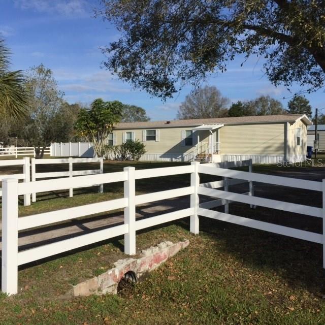 11008 Rodeo Lane Riverview, FL 33579 - Photo 1 of 1 Fenced yard to property entrance.