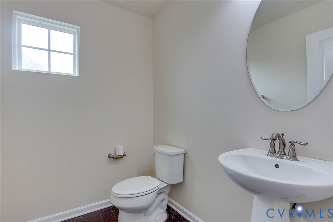12219 Almer Lane Chester, VA 23836 - Photo 22 of 46 a bathroom with a sink a toilet and a mirror