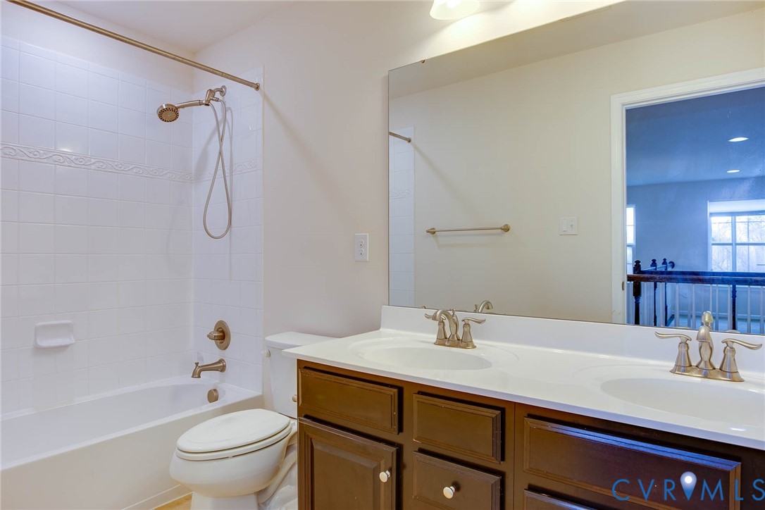 12219 Almer Lane Chester, VA 23836 - Photo 40 of 46 a bathroom with a sink a toilet and shower