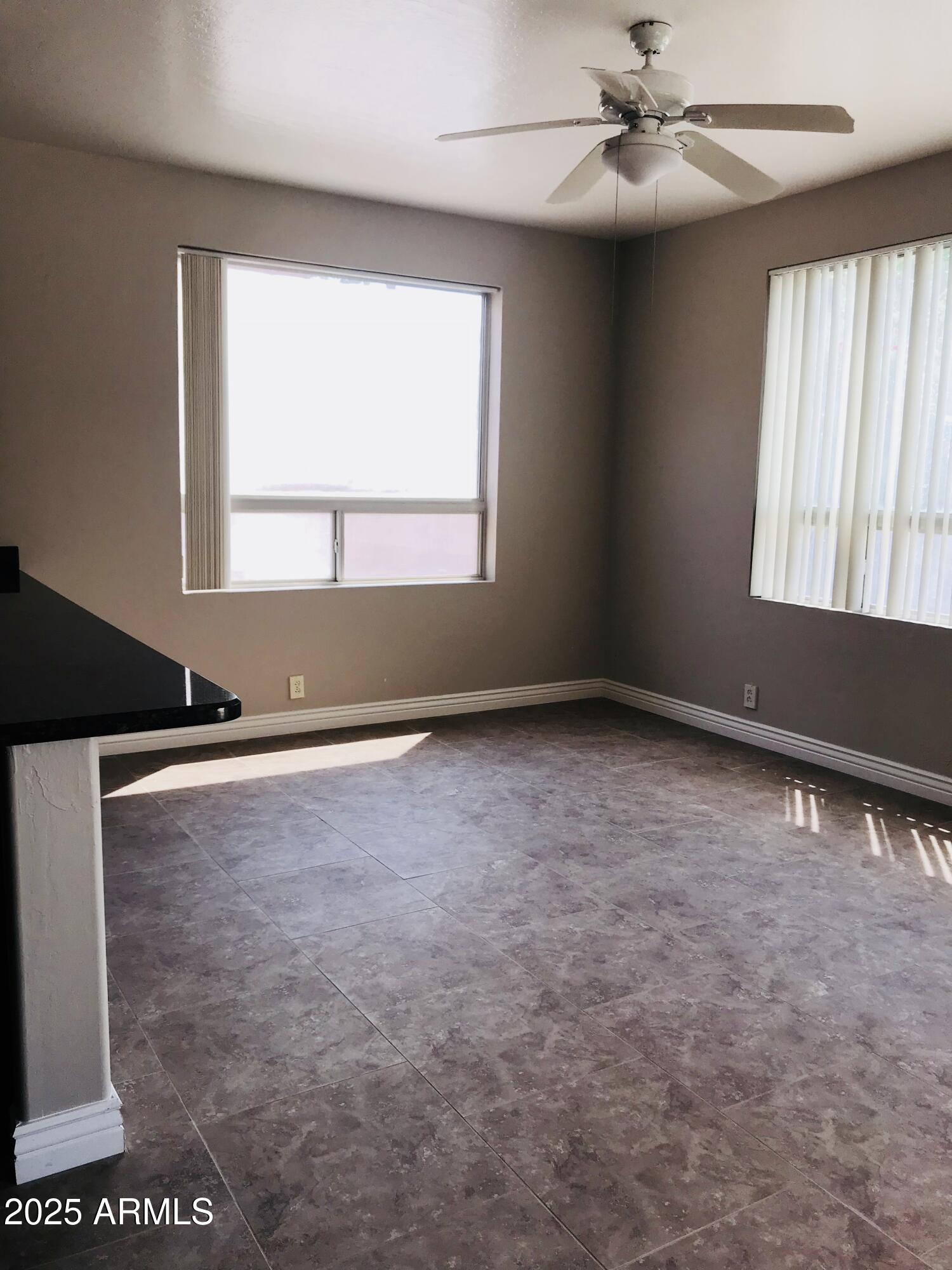 3670 South Heath Way Chandler, AZ 85248 - Photo 12 of 29 an empty room with windows and fan