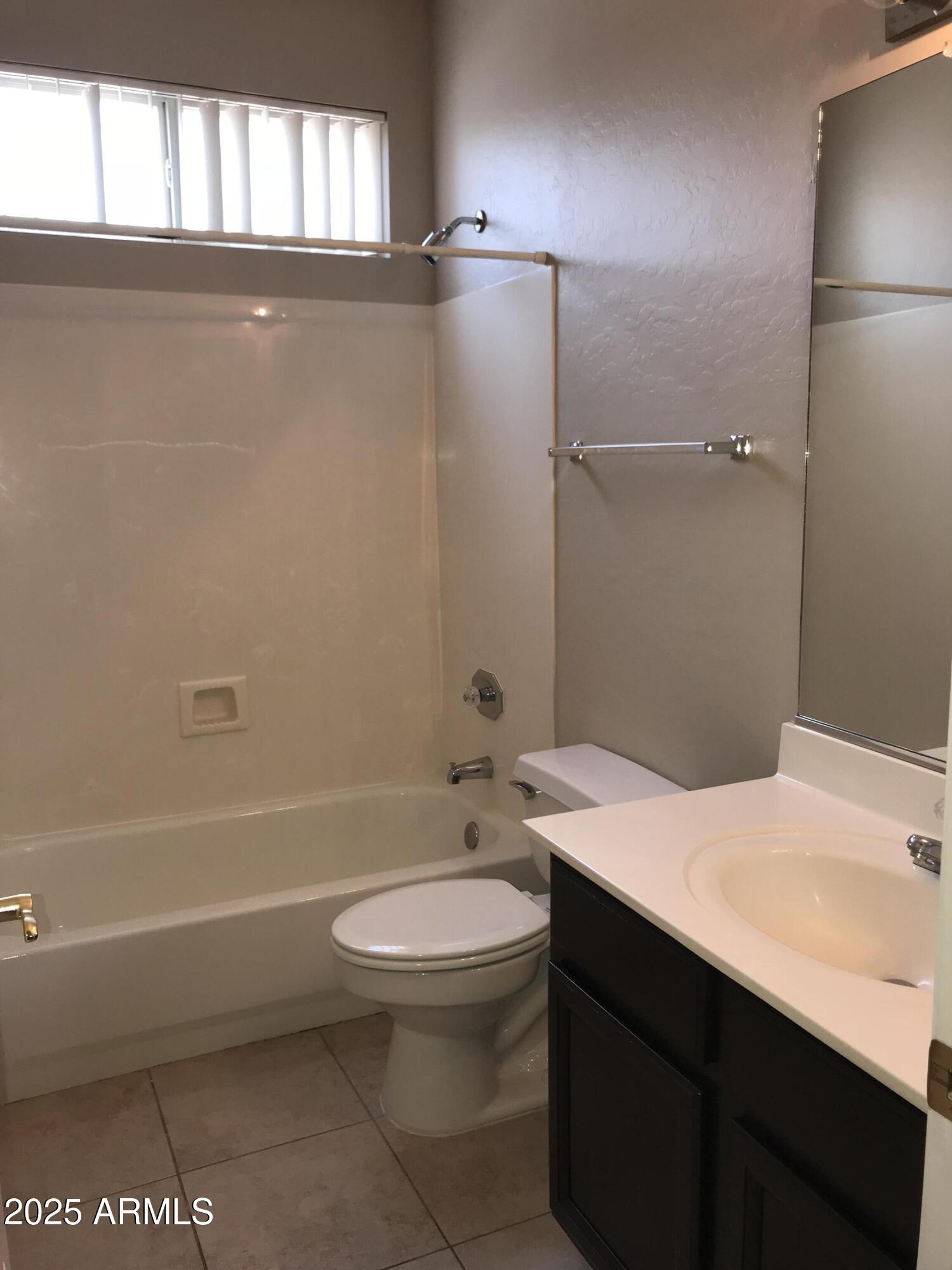 3670 South Heath Way Chandler, AZ 85248 - Photo 24 of 29 a bathroom with a sink a toilet and shower