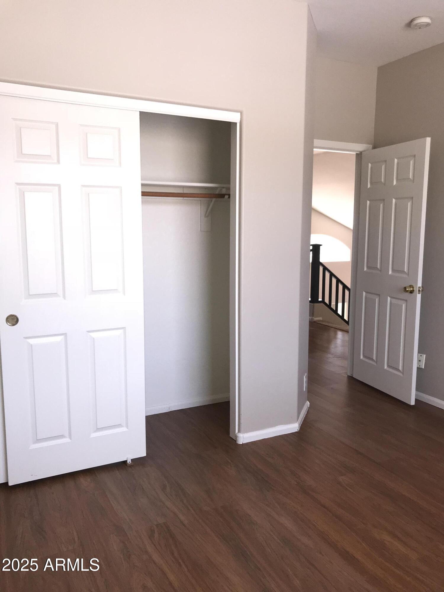 3670 South Heath Way Chandler, AZ 85248 - Photo 26 of 29 a view of an empty room with wooden floor and a window