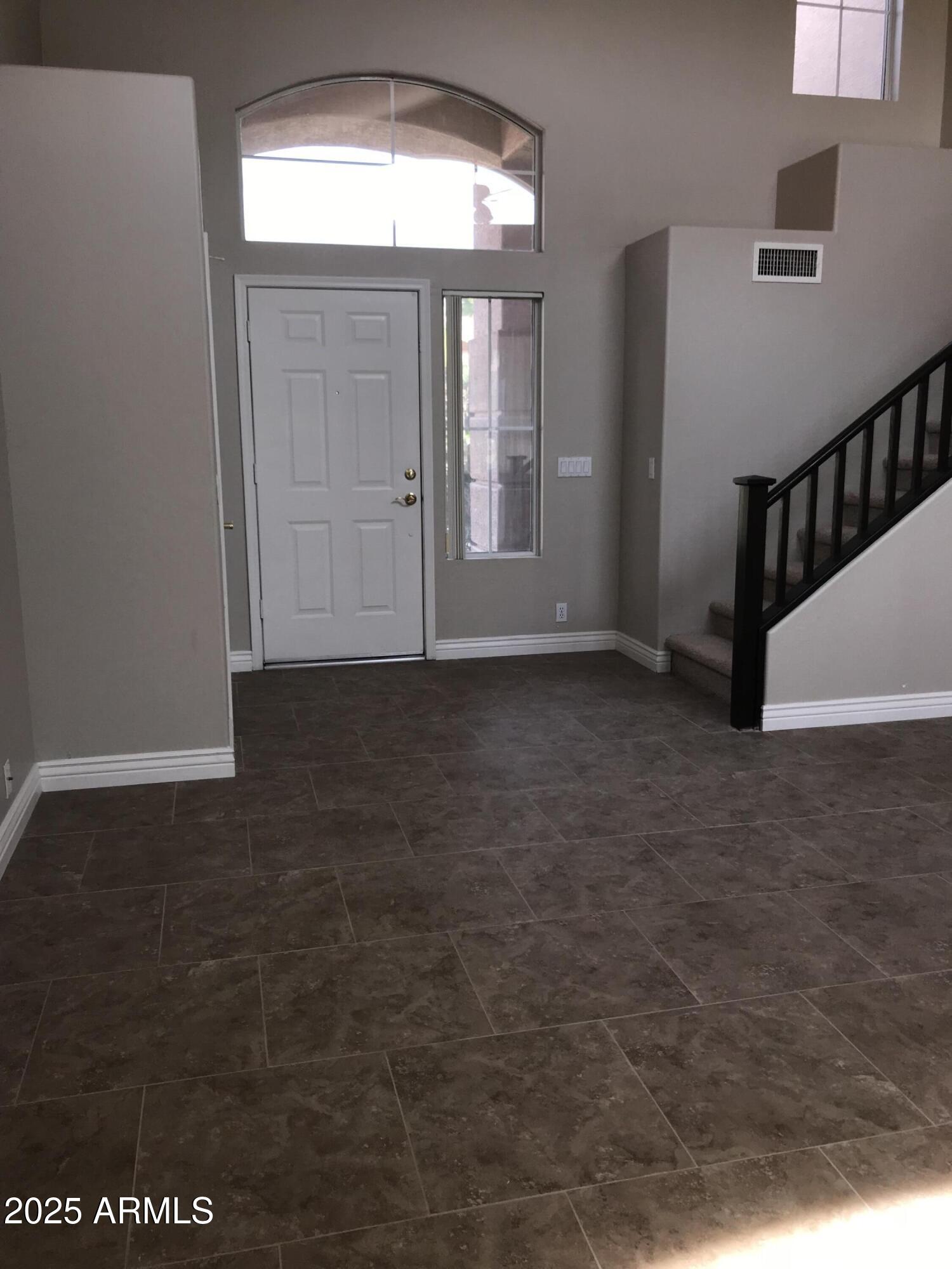 3670 South Heath Way Chandler, AZ 85248 - Photo 3 of 29 a view of an empty room with a window