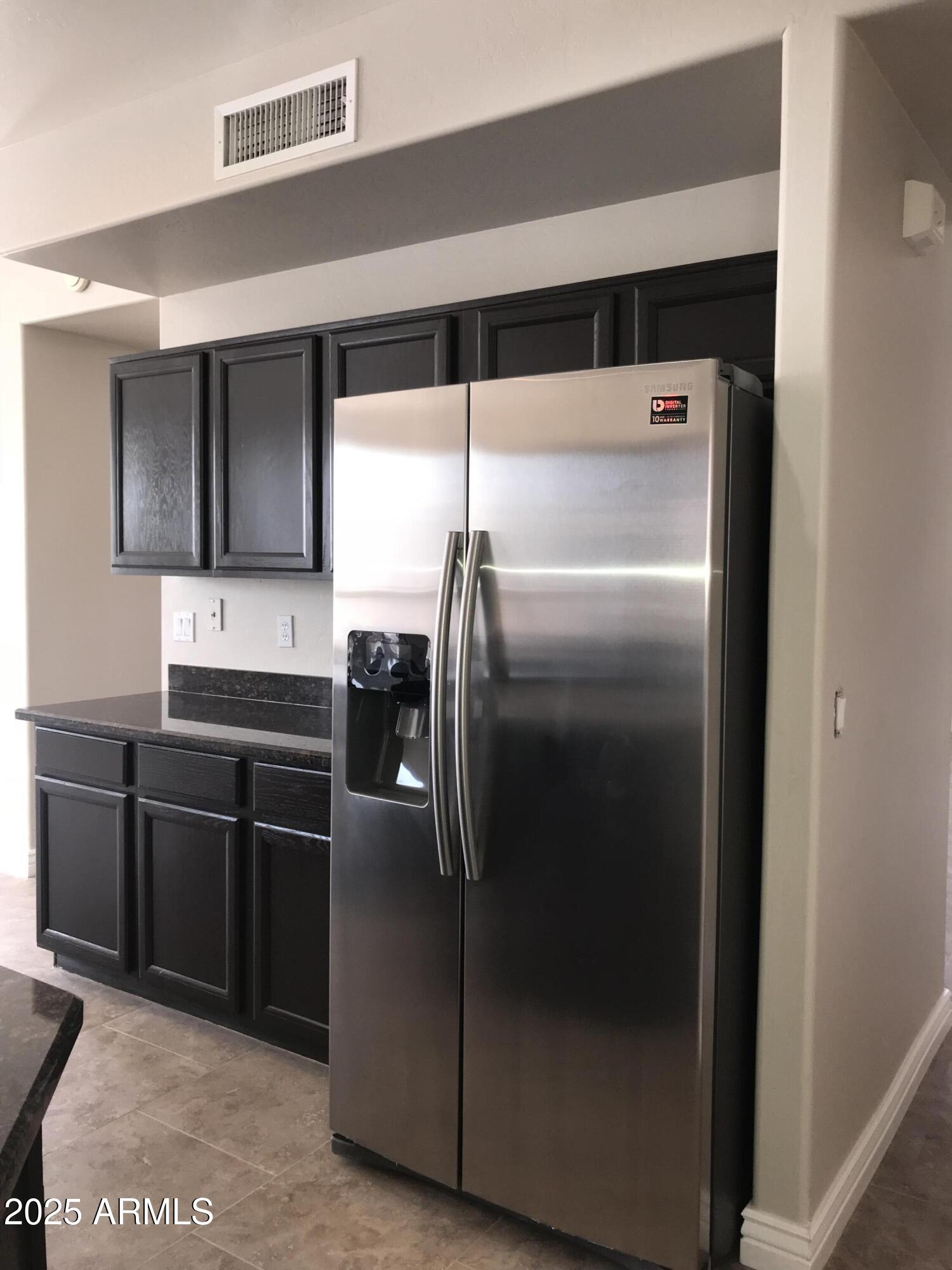 3670 South Heath Way Chandler, AZ 85248 - Photo 9 of 29 a kitchen with a refrigerator and a sink
