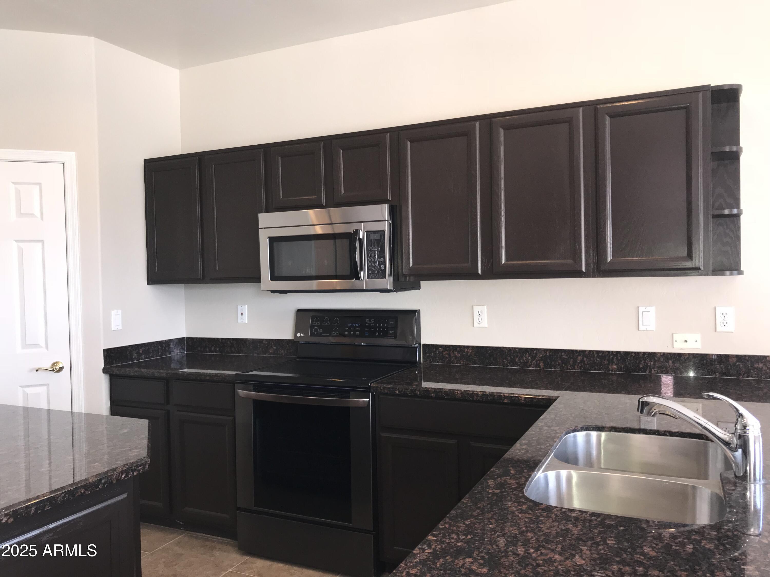 3670 South Heath Way Chandler, AZ 85248 - Photo 10 of 29 a kitchen that has a sink and a microwave