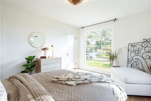a kitchen with a sink stove and white cabinets