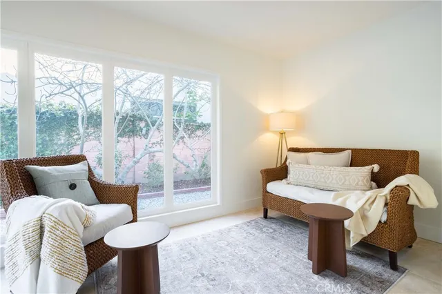 a bedroom with a bed and a night stand