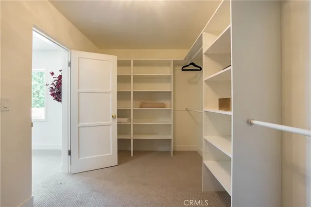 a bathroom with a sink mirror and shower
