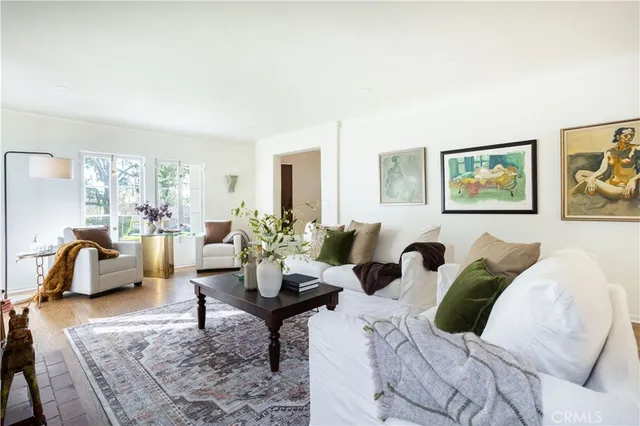 a view of a living room with furniture and a rug